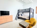 Bunks for the kids, retro chairs & chess for the cool kids.
